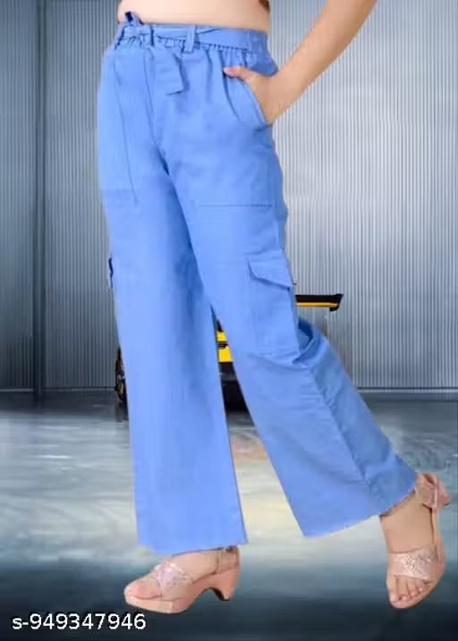These are Four pocket light blue high-rise oversized cargo pants featuring side flap pockets and a drawstring waist