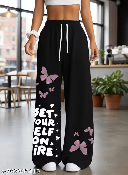 Woman and girls pants shown in the image are black in colour with pink butterflies print and pants